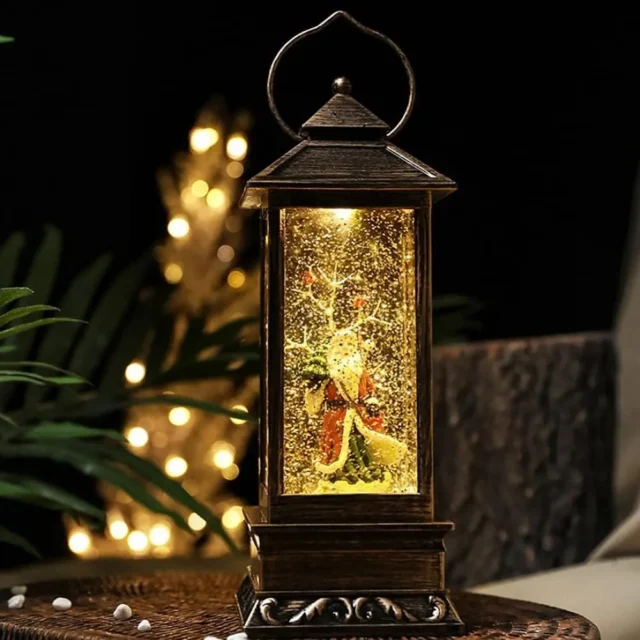 Linterna navideña decorativa con Santa Claus, luz LED, efecto de nieve y música; ideal para decorar salas, oficinas, mesas y espacios festivos., foto 1 de 3