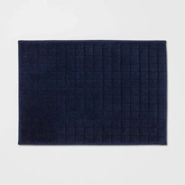 Alfombra de baño de espuma con diseño de cuadrícula de terciopelo de 43 x 60 cm .