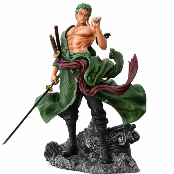 Figura coleccionable de Roronoa Zoro de la serie One Piece, en pose de combate con capa verde, faja roja y espadas, base de roca decorativa de 27 cm de alto, para vitrina o escritorio, foto 1 de 5