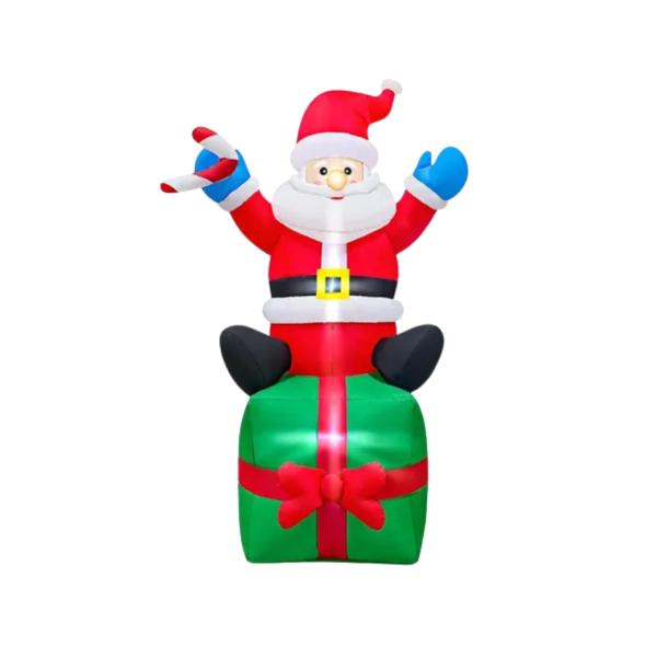 Inflable navideño de Papá Noel sobre caja de regalo verde con lazo rojo, con bastón de dulce en una mano y saludo con la otra, iluminado por dentro, para decorar patio o jardín en Navidad, foto 4 de 4